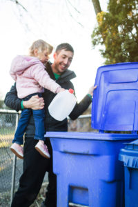 Father and Child Taking Out Recycle Trash