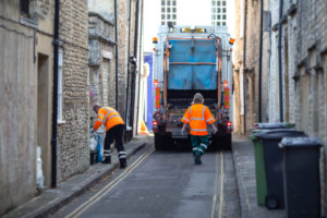 Bin men, Rubbish collectors or garbage men collecting household waste and recycling