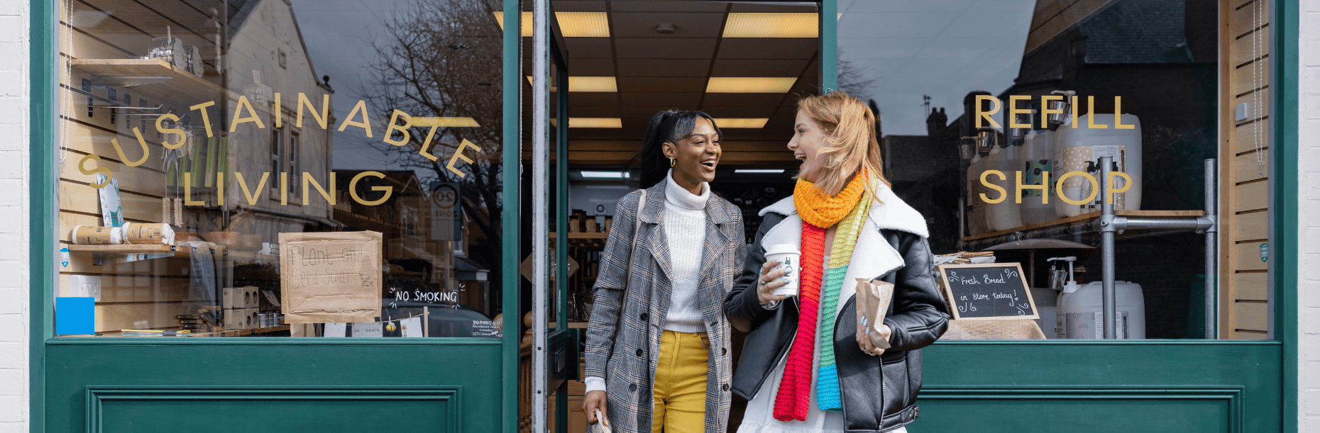 Two shoppers standing outside a sustainable living refill shop