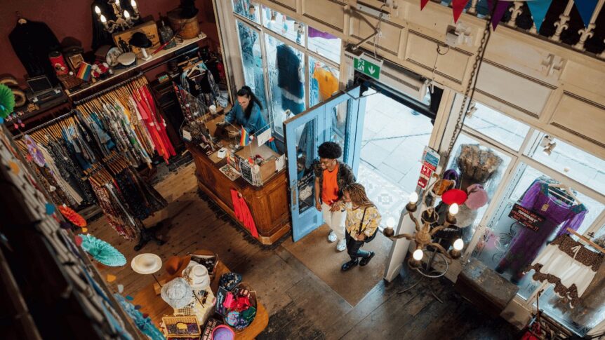 Man and woman entering a second hand shop